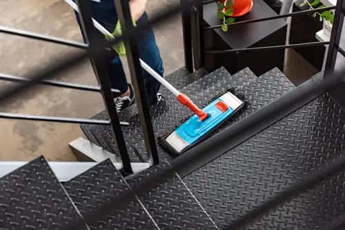 Commercial cleaning team detailing a lobby and shared surfaces