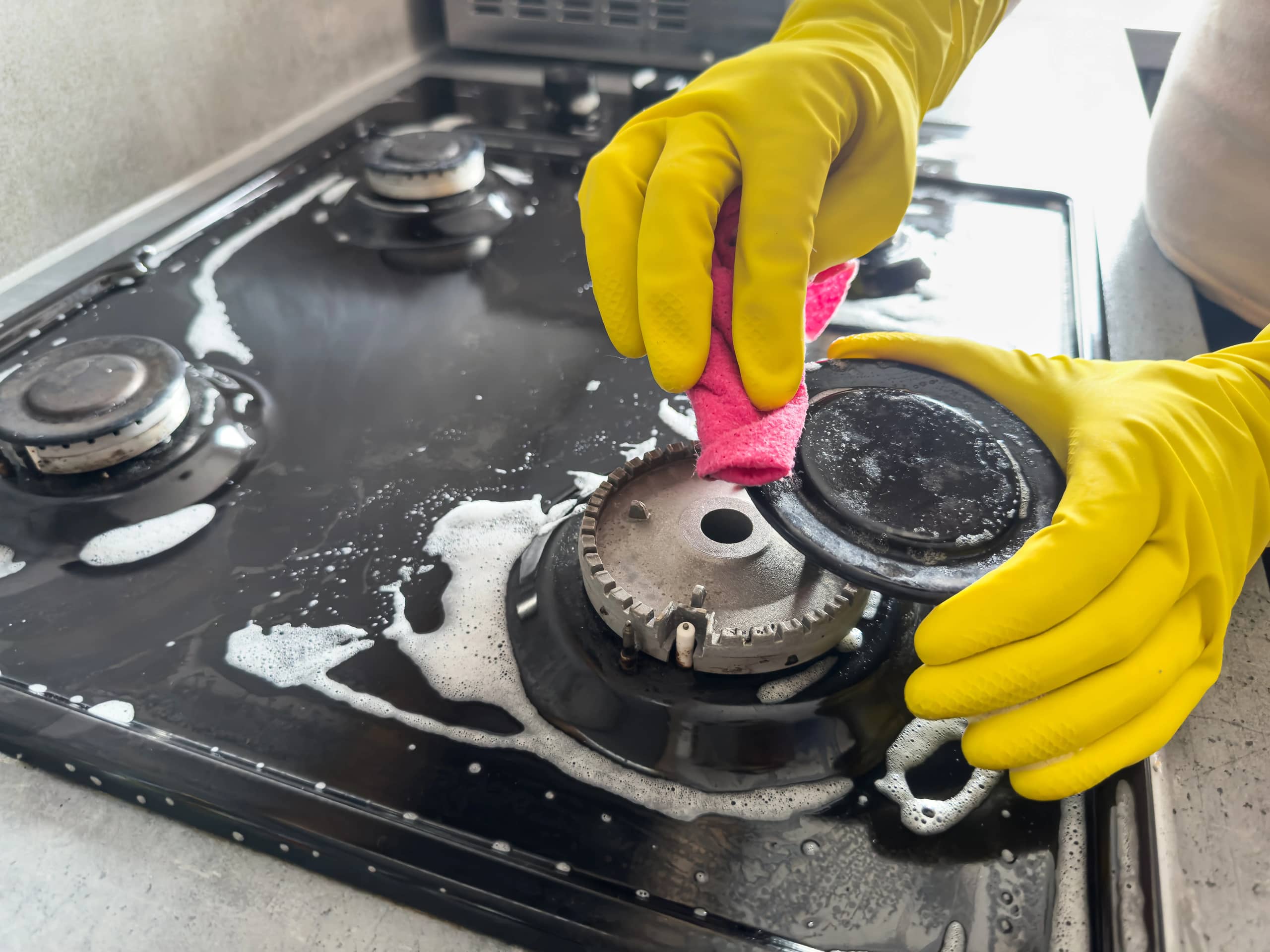 Kitchen deep cleaning: detail scrub and wipe for grease and buildup