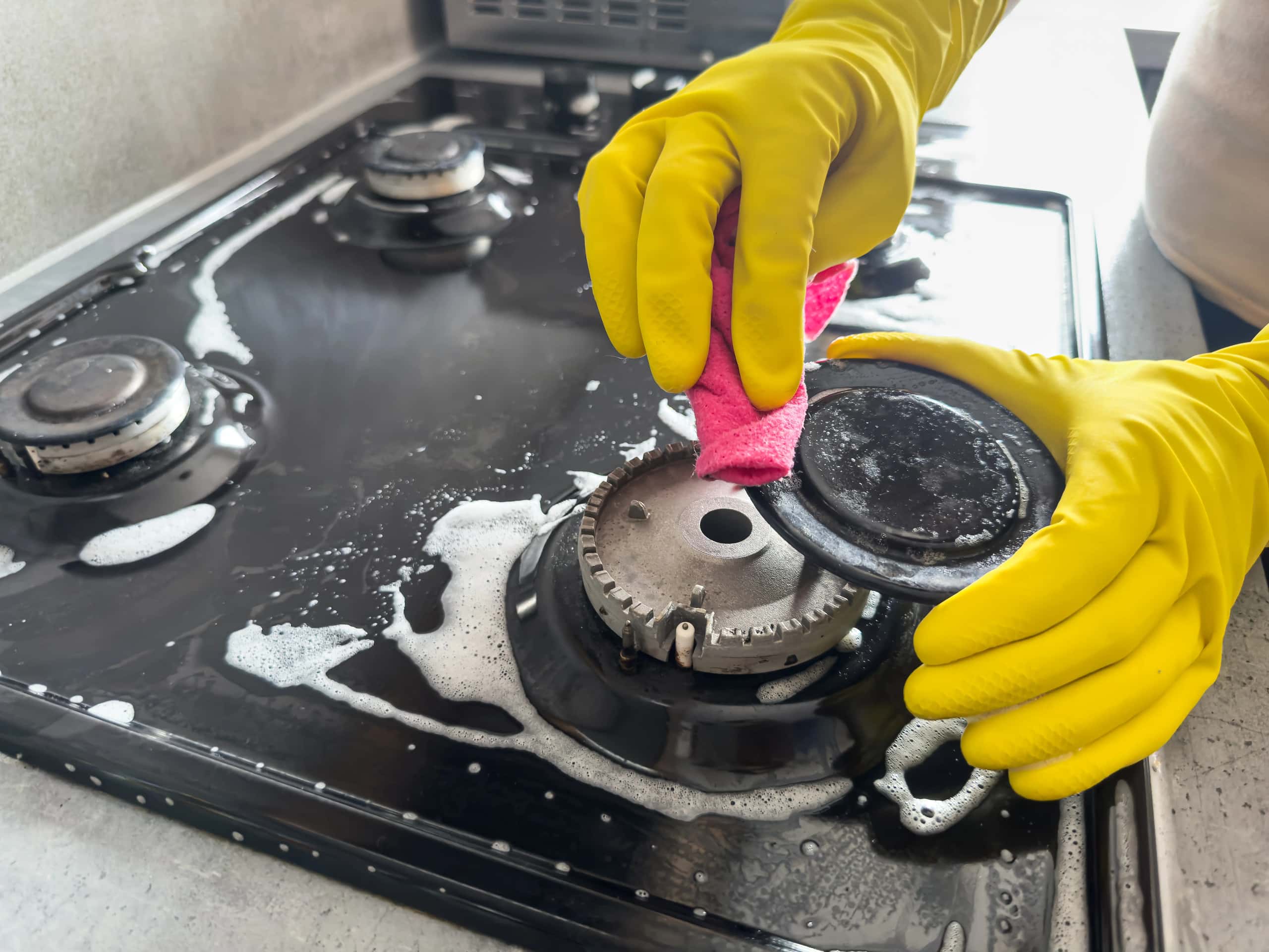 Kitchen deep cleaning: detail scrub and wipe for grease and buildup